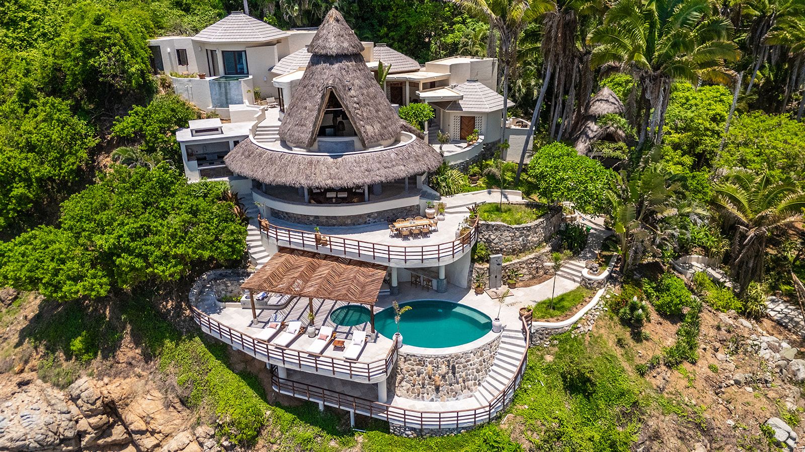 Aerial view of Villa Caleta on the rocks